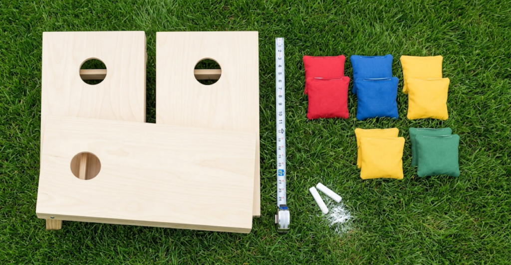 Flat lay of cornhole gifts under 25 dollars including bag holders socks and keychain
